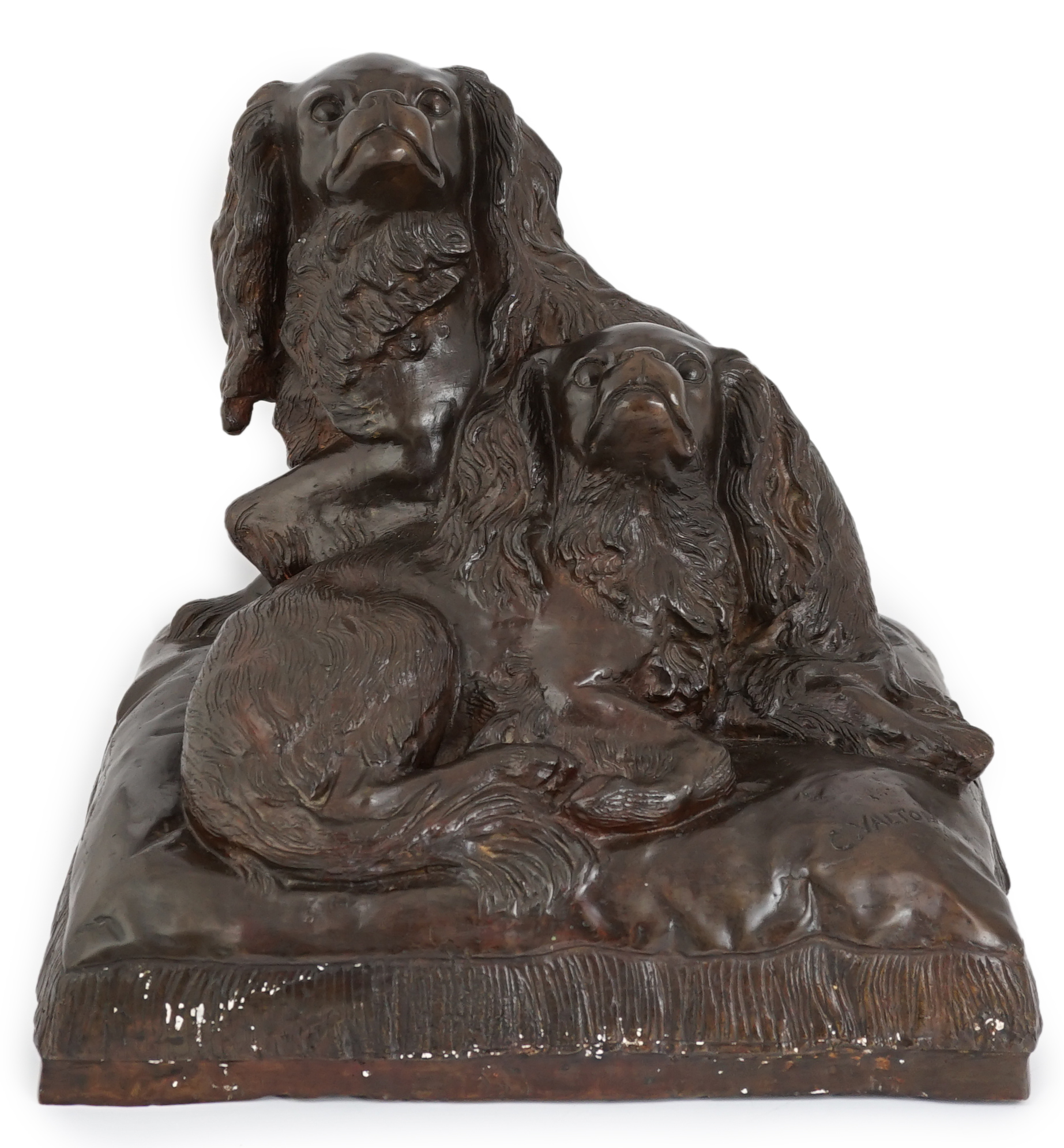 After Charles Valton (French, 1851-1819), a bronze group of two King Charles spaniels seated upon a cushion, 46cm wide, 42cm high